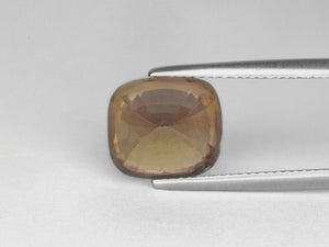 8800061-cushion-yellowish-brown-aigs-madagascar-natural-other-fancy-sapphire-8.87-ct