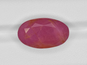 8801246-oval-deep-pinkish-red-with-orange-staining-gii-guinea-natural-ruby-19.62-ct