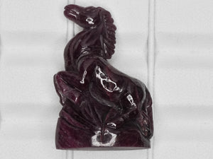 8801460-carved-dark-purple-red-gii-liberia-natural-ruby-63.28-ct