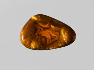 8802406-cabochon-brown-with-multi-color-swirls-&-bubbles-igi-mexico-natural-fire-agate-19.72-ct